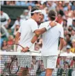 ?? NIC BOTHMA, EPA ?? Roger Federer, left, consoles Alexandr Dolgopolov, who retired in the second set.