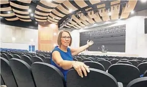  ?? RED HUBER/STAFF PHOTOGRAPH­ER ?? Margaret Gunderson, principal at the new Millennium Middle School, shows off the auditorium.