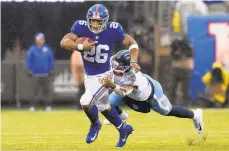  ?? SARAH STIER/GETTY IMAGES ?? Saquon Barkley was held to 31 yards on 14 carries in the loss to the Titans last week, his second-lowest total this season.