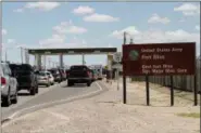  ?? JUAN CARLOS LLORCA — THE ASSOCIATED PRESS FILE ?? Cars wait to enter Fort Bliss in El Paso, Texas. The U.S. Department of Homeland Security has formally requested space for up to 12,000 beds at a military base to detain families caught crossing the border illegally, two Trump administra­tion officials...