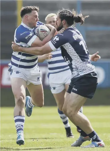  ??  ?? HEAD-TO-HEAD: Halifax Panthers failed to recover from a poor start in their Betfred Championsh­ip clash with Toulouse. Picture: Simon Hall