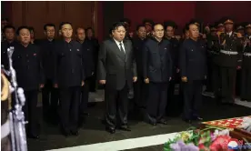  ?? Photograph: Korean Central News Agency/AP ?? North Korean leader Kim Jong-un (front centre) pays tribute to former propaganda chief Kim Ki Nam, who has died aged 94, at a funeral hall in Pyongyang.