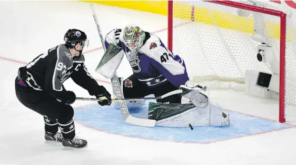  ?? HARRY HOW/GETTY IMAGES ?? Pacific Division captain Connor McDavid shoots against Central Division goaltender Devan Dubnyk during the all-star tournament on Sunday in Los Angeles.