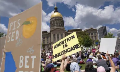  ?? Photograph: Ben Gray/AP ?? Abortion rights protesters rally near the Georgia state capitol in Atlanta in May.