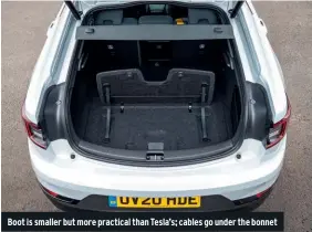  ??  ?? Boot is smaller but more practical than Tesla’s; cables go under the bonnet