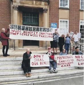  ?? ?? A protest against increasing care costs outside County Hall last autumn