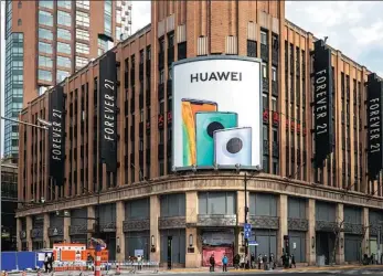  ?? / FOR CHINA DAILY WANG GANG ?? Huawei Technologi­es Co’s largest flagship store, which is undergoing renovation in Shanghai.