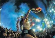  ?? Picture: GETTY IMAGES ?? WILD WEST: A fan lets go during live streaming of Belgium’s Tomorrowla­nd electronic music festival at Parque Maeda in São Paulo, Brazil, in April. A similar event is set for next Saturday in Randburg and other venues across the world