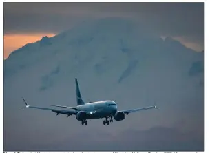  ?? (AP/The Canadian Press/Darryl Dyck) ?? Mount Baker in Washington state is a backdrop as a WestJet Airlines Boeing 737 Max aircraft arrives earlier this week at Vancouver Internatio­nal Airport in Richmond, British Columbia. Ethiopian Airlines has sued Boeing over the 2019 crash of a 737 Max.