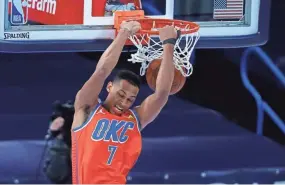  ?? ALONZO ADAMS/USA TODAY SPORTS ?? Thunder forward Darius Bazley (7) dunks against the Milwaukee Bucks during the first half at Chesapeake Energy Arena on Sunday.