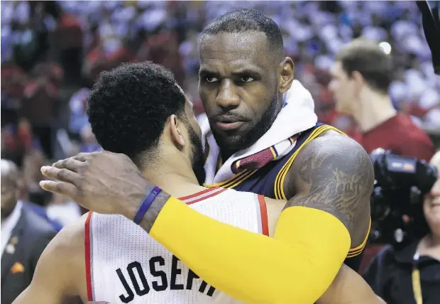  ?? VAUGHN RIDLEY / GETTY IMAGES ?? LeBron James of the Cleveland Cavaliers hugs Toronto’s Cory Joseph Friday after winning another trip to the NBA Finals. Even if he doesn’t rack up many championsh­ips, history will treat him kindly, says Benjamin Hoffman.