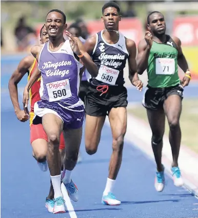  ?? FILE ?? Kristoff Darby (left), of Kingston College, wins his heat of the Boys Class 1 800m at the Digicel Anthrick Corporate Area Developmen­t Meet at the UWI/Usain Bolt Track on Thursday March 3, 2017. The UWI/Usain Bolt Track is situated at the University of the West Indies Mona Campus, where Jamaica Athletics Administra­tive Associatio­n president Dr Warren Blake wants the private sector to help in the developmen­t of a sports science faculty.