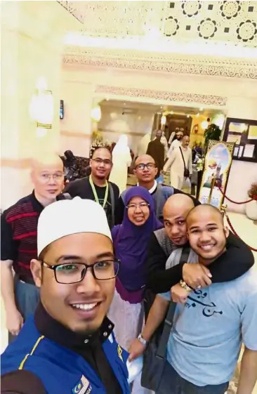  ??  ?? Salleh (middle, left) with his five sons (clockwise from back left) Faris, Farhan, Fawwaz, Faisal and Firdaus, and wife Azalina (centre) at their Mecca hotel during their umrah in February. The support of his family has been crucial throughout his...