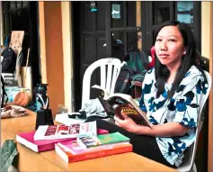  ?? — AFP photo ?? Erwiana posing at her rented room near her university in Yogyakarta.