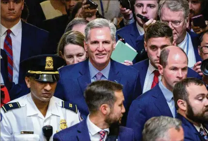  ?? MANDEL NGAN/AFP/GETTY IMAGES/TNS ?? After he was deposed as speaker of the House of Representa­tives in a historic action engineered by a disgruntle­d, hard-right faction of the Republican Party, Rep. Kevin McCarthy of California is escorted from the House chamber Tuesday.