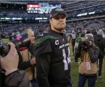  ?? SETH WENIG - THE ASSOCIATED PRESS ?? New York Jets quarterbac­k Sam Darnold (14) walks off the field after the Jets beat the Miami Dolphins 22-21 in an NFL football game, Sunday, Dec. 8, 2019, in East Rutherford, N.J.