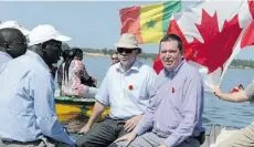  ?? A F P/G e t ty I m ag e s/ F i l e ?? Internatio­nal Developmen­t Minister Christian Paradis, right, has acknowledg­ed the important role of foreign aid groups.