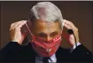  ?? KEVIN DIETSCH — THE ASSOCIATED PRESS ?? Dr. Anthony Fauci and other medical experts urge people to continue to wear masks while in public and practice social distancing, but many Americans fail to heed their advice.