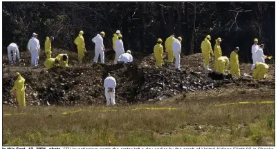  ?? (AP file photo) ?? In this Sept. 12, 2001, photo, FBI investigat­ors comb the crater left a day earlier by the crash of United Airlines Flight 93 in Shanksvill­e, Pa. Among the 44 people who died, including four terrorists, was Tom Burnett, husband of Dermott native Deena Burnett Bailey.