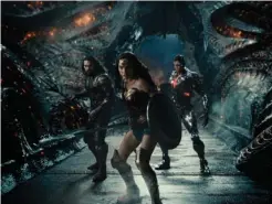  ?? Associated Press ?? This image released by HBO Max shows, from left, Jason Momoa as Aquaman, Gal Gadot as Wonder Woman, and Ray Fisher as Cyborg, in a scene from “Zack Snyder’s Justice League.”