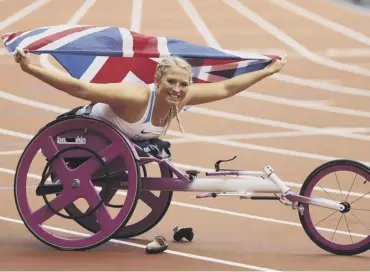  ??  ?? 0 Sammi Kinghorn celebrates after winning the women’s 100m final at the 2017 World Championsh­ips.