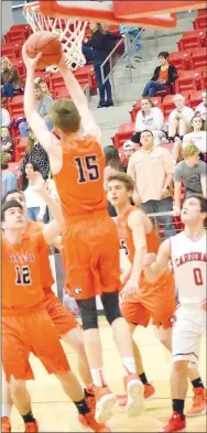  ?? Westside Eagle Observer/MIKE ECKELS ?? Triston Batie (Gravette 15) puts up a jumper during the Feb. 1 Farmington-Gravette conference basketball contest in Farmington. The Lions overwhelme­d the Cardinals, 55-44, to take the conference win.