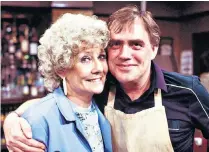  ??  ?? Liz Dawn as Vera Duckworth with her screen husband Jack (Bill Tarmey) in Coronation Street (1988) and, below, after receiving her MBE in 2000