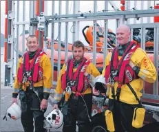  ??  ?? Alex (centre) with two of the crew of the Arran lifeboat.