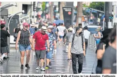  ?? AFP ?? Tourists stroll along Hollywood Boulevard’s Walk of Fame in Los Angeles, California in this Aug 16 photo.