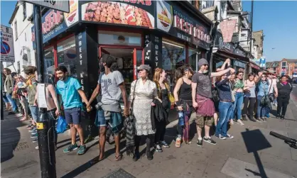  ?? Photograph: Peter Marshall/Alamy Stock Photo ?? Protesters demonstrat­e against the demolition of a market in London’s Latin Village in 2017.