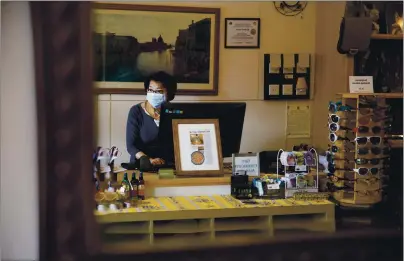  ?? DAI SUGANO — STAFF PHOTOGRAPH­ER ?? Bay Home and Linens owner Lina Yea works inside her store in downtown San Mateo on Monday. Yea’s store is one of many businesses that reopened Monday as part of phase 2 of Gov. Gavin Newsom’s reopening guidance.