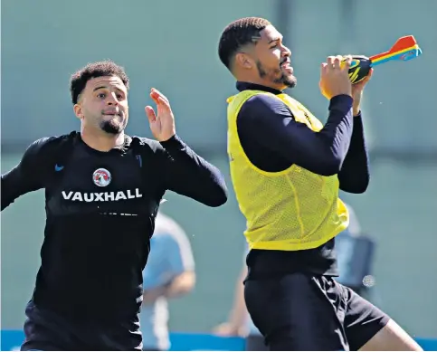  ??  ?? Catch of the day: Ruben Loftus-Cheek, who is poised to start against Panama, shows his reflexes alongside Kyle Walker during an England training session in Zelenogors­k