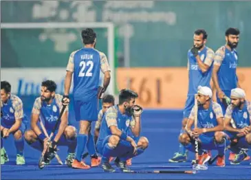  ?? AFP ?? India players look stunned after Malaysia defeated them in their Asian Games hockey semifinal match in Jakarta on Thursday.