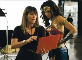 ?? CLAY ENOS/ WARNER BROS. ENTERTAINM­ENT VIA AP ?? Director Patty Jenkins, left, with actress Gal Gadot on the set of “Wonder Woman 1984.”