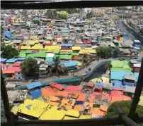  ?? AFP ?? Houses painted in bright colours at a fishing area in Mumbai. —