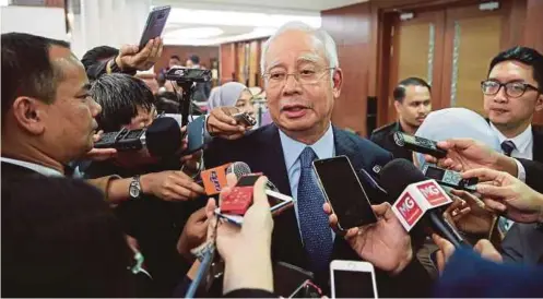  ?? FILE PIC ?? Former prime minister Datuk Seri Najib Razak speaking to reporters in Parliament recently. Najib is facing 32 charges, all linked to 1MDB funds.