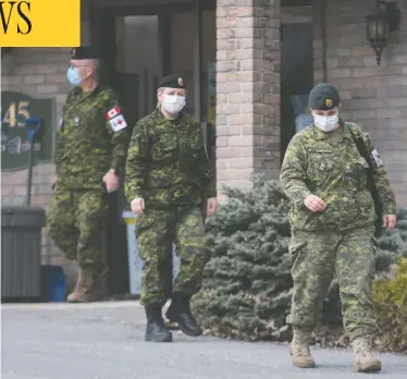  ?? GRAHAM HUGHES / THE CANADIAN PRESS ?? Canadian Forces members help out at Villa Val des Arbres, a long-term care home in Laval, Que., on April 19. More than 1,000 military members are now helping the province with its COVID-19 response.