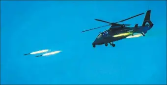  ?? PROVIDED TO CHINA DAILY ?? An attack helicopter engages in a live-fire exercise off the country’s southeaste­rn coast on Wednesday.