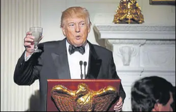  ?? AP ?? President Donald Trump makes a toast during a dinner reception for US governors at the White House.