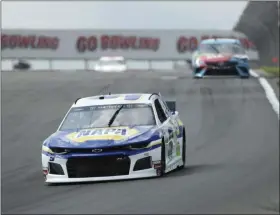  ?? JOHN MUNSON — THE ASSOCIATED PRESS ?? Chase Elliott heads into turn one during practice for the NASCAR Cup Series race at Watkins Glen Internatio­nal on Aug. 3 in Watkins Glen, New York.