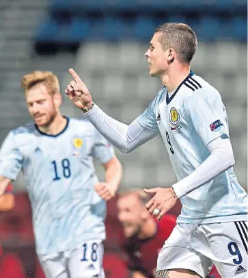  ?? Pictures: PA. ?? Left: Ryan Christie beats Czech Republic goalkeeper Ales Mandous from the penalty spot to give Scotland the lead; above: Lyndon Dykes celebrates his first goal for the national team on his second start; below: Liam Palmer gets a cross over despite the home defenders’ efforts.