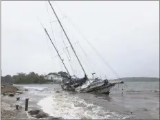  ?? Contribute­d photo ?? Ed Train’s boat, which became unmoored during a storm in September, has still not been removed from the Saugatuck Shore.