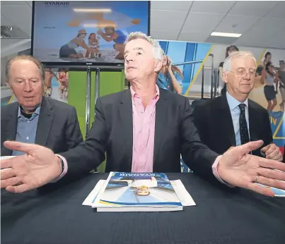  ?? Picture: PA. ?? Ryanair boss Michael O’Leary, centre, at the AGM at the airline’s Dublin headquarte­rs.