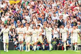  ??  ?? Real Madrid need just a point to clinch the La Liga title when they travel to Malaga on Sunday.