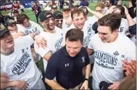  ?? Icon Sportswire via Getty Images ?? Yale players and coach Andy Shay celebrate after defeating Duke to win the NCAA men’s championsh­ip on May 28, 2018.