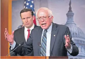  ?? [AP PHOTO] ?? Sen. Bernie Sanders, I-Vt., joined at left by Sen. Chris Murphy, D-Conn., holds a news conference Thursday after the Senate passed a resolution he introduced that would pull assistance from the Saudi-led war in Yemen, a measure to rebuke Saudi Arabia after the killing of journalist Jamal Khashoggi, at the Capitol in Washington.