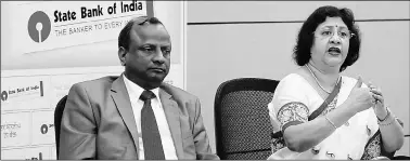  ?? Nirmal Harindran ?? SBI Chairman Arundhati Bhattachar­ya (right) with SBI Managing Director Rajnish Kumar during the press briefing on interest rates and effects of demonetisa­tion at SBI Bhavan in Mumbai on Monday.