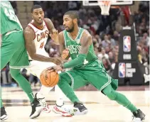  ?? AP PHOTO ?? Boston Celtics’ Kyrie Irving (right)