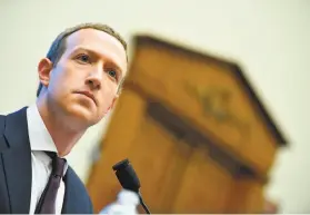  ?? Mandel Ngan / AFP / Getty Images ?? Facebook CEO Mark Zuckerberg defends the company’s practices in the face of criticism and threats of increased government regulation.