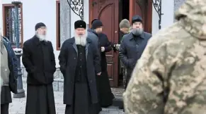  ?? ?? Under investigat­ion: a screencap of a clip showing Ukrainian security forces speaking to orthodox priests whose faces are blurred at the Kyiv Pechersk Lavra monastery. — reuters